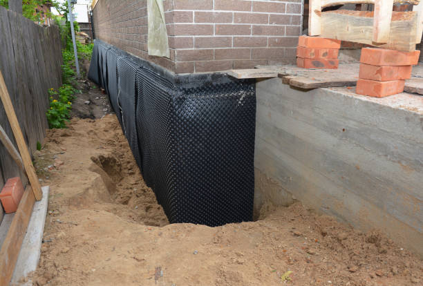 Happy homeowners after waterproofing job in Mableton